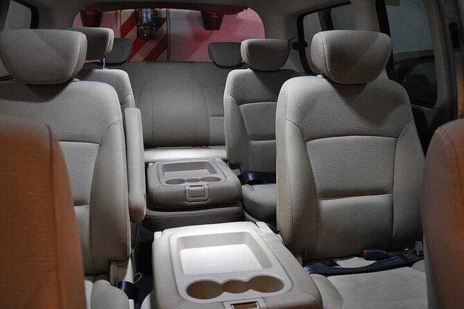 Private Transfer Tahiti Airport PPT to Papeete Urban Area by Van - Flower leis, water, and a warm first impression